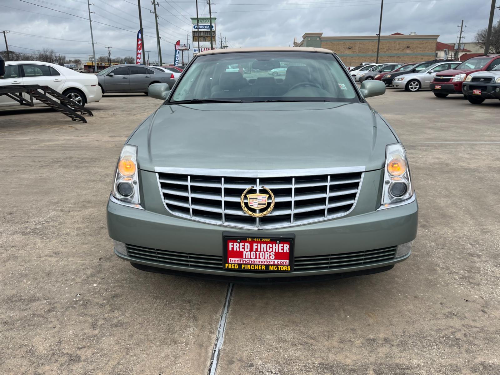 2006 green /TAN Cadillac DTS Sedan (1G6KD57Y96U) with an 4.6L V8 DOHC 32V engine, 4-Speed Automatic Overdrive transmission, located at 14700 Tomball Parkway 249, Houston, TX, 77086, (281) 444-2200, 29.928619, -95.504074 - Photo #1